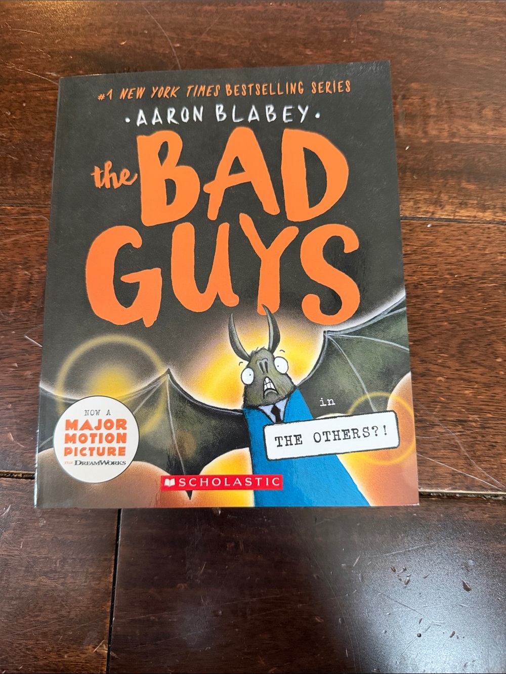 Scholastic The Bad Guys Cover — Orange & Black with Blue Accent